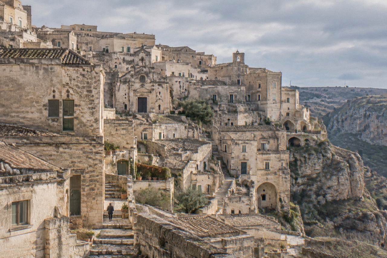 Pale stone buildings of the Sassi district in Matera under a grey winter sky