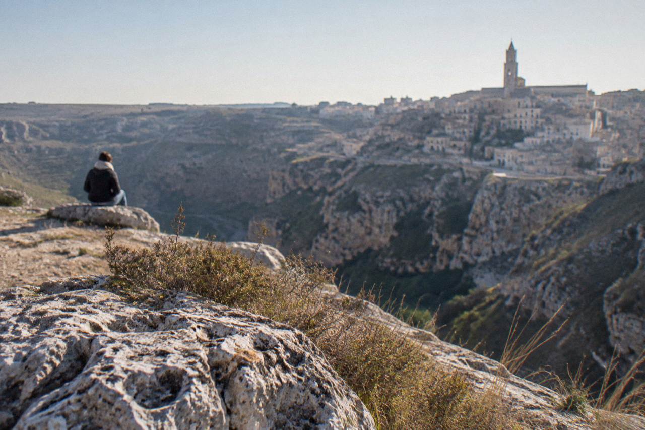 Cave dwellings and stone houses of the Sassi districts rising above the Gravina canyon in Matera