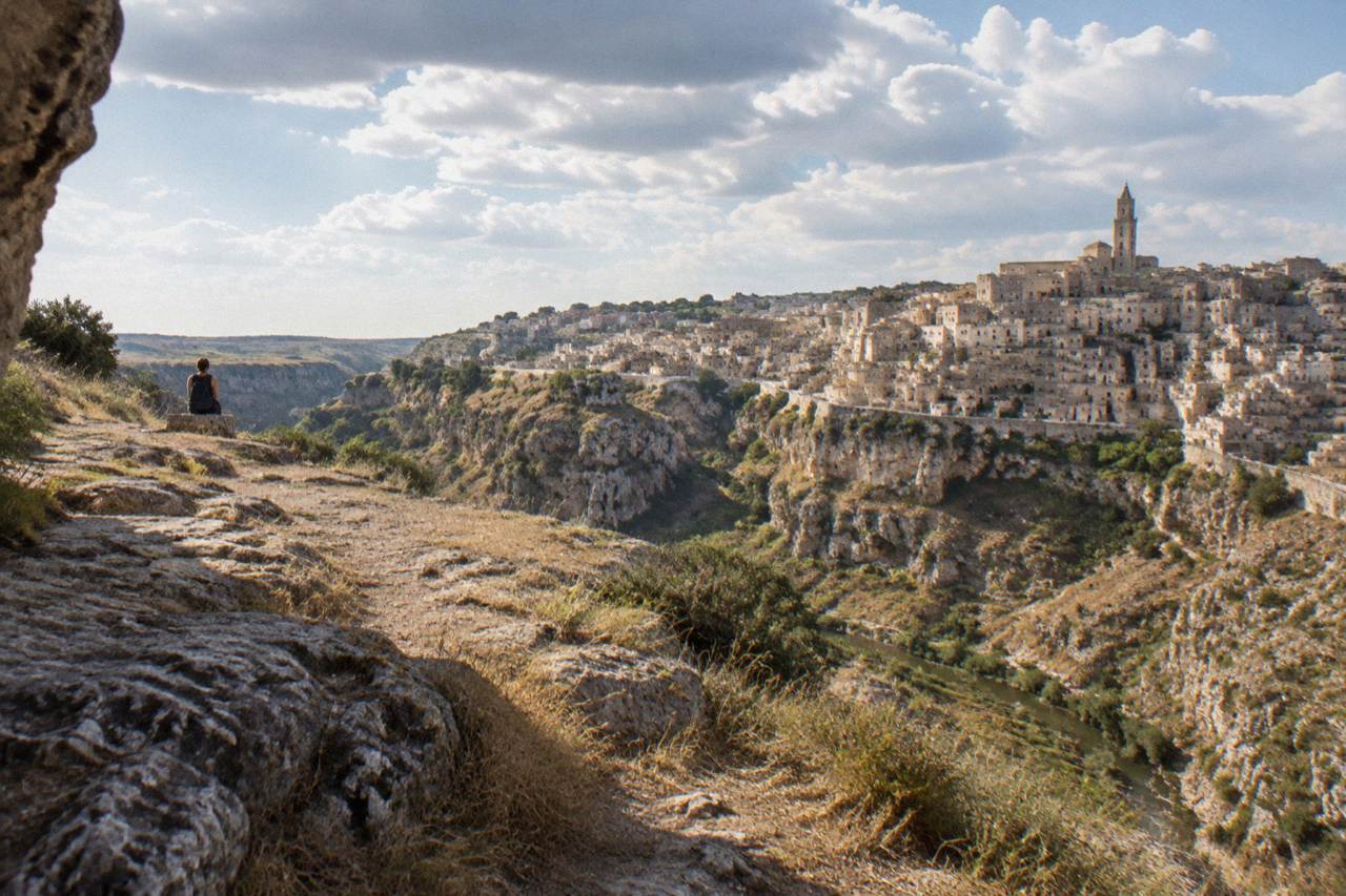 Cave dwellings and stone houses of the Sassi districts rising from the edge of the Gravina canyon in Matera