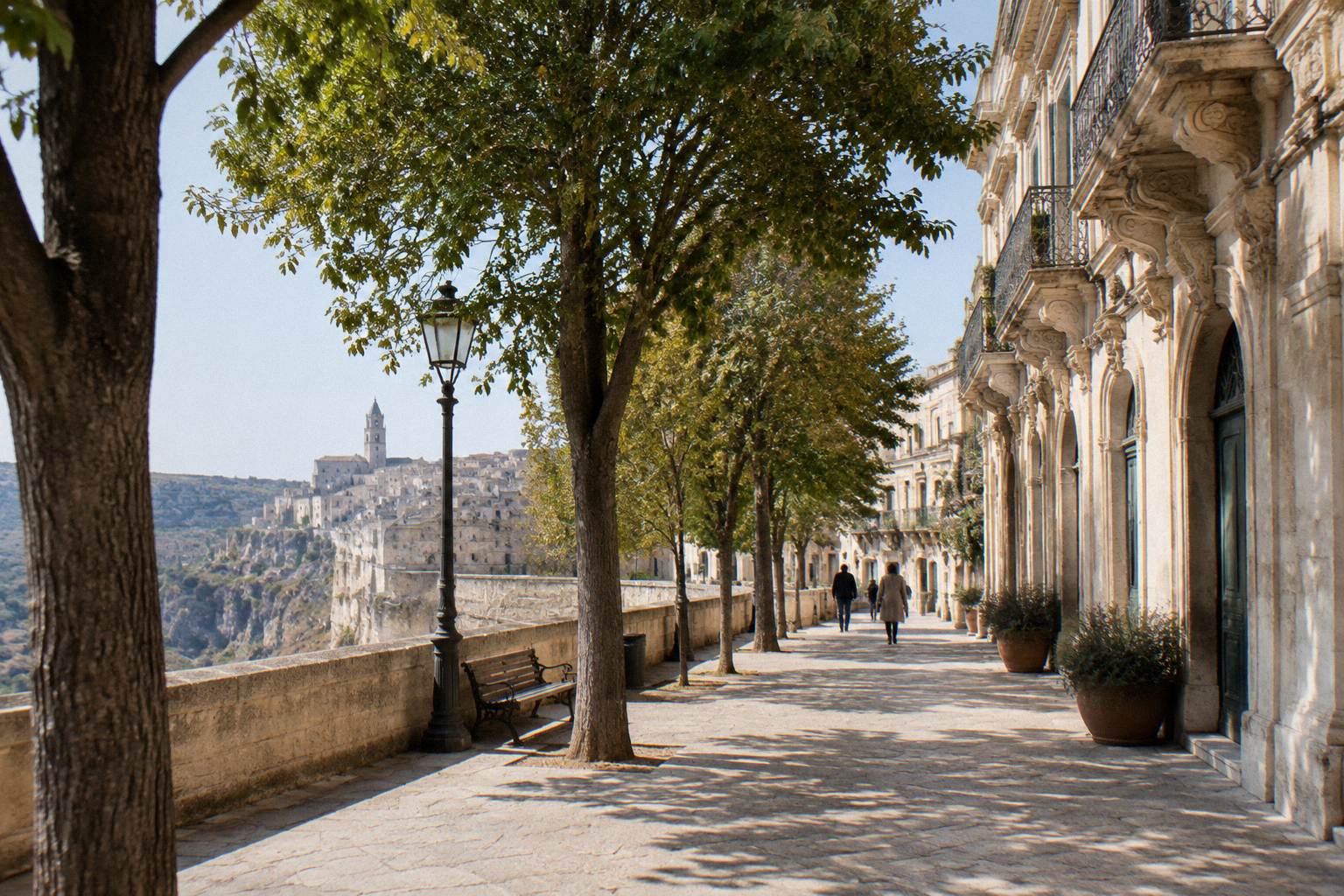 Baroque palace facades and a tree-lined pedestrian street in the upper town