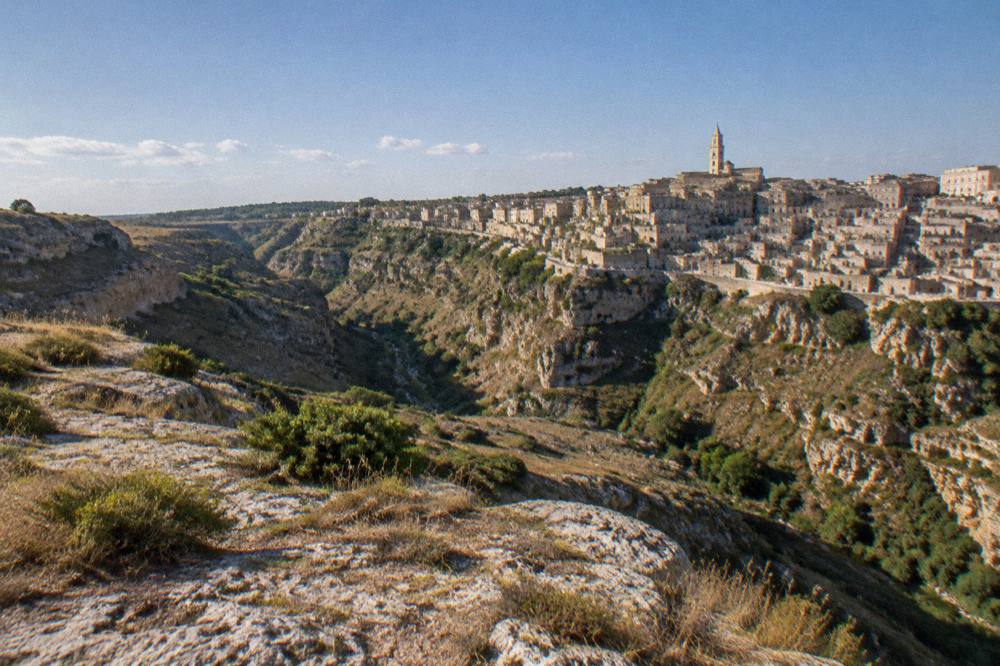 Panorama of the Sassi of Matera and the Gravina canyon seen from the Murgia plateau