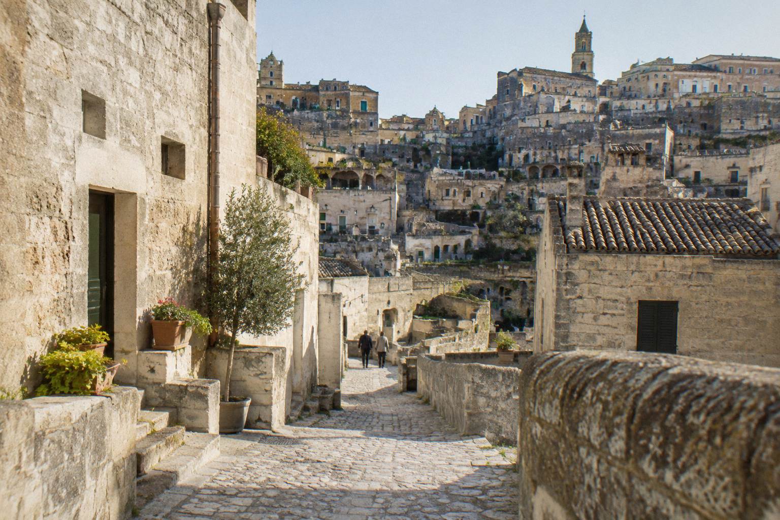 Terraced stone houses and lanes of Sasso Barisano in soft afternoon light