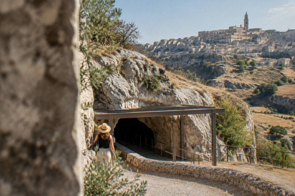 Hilltop town with stone buildings rising above open countryside