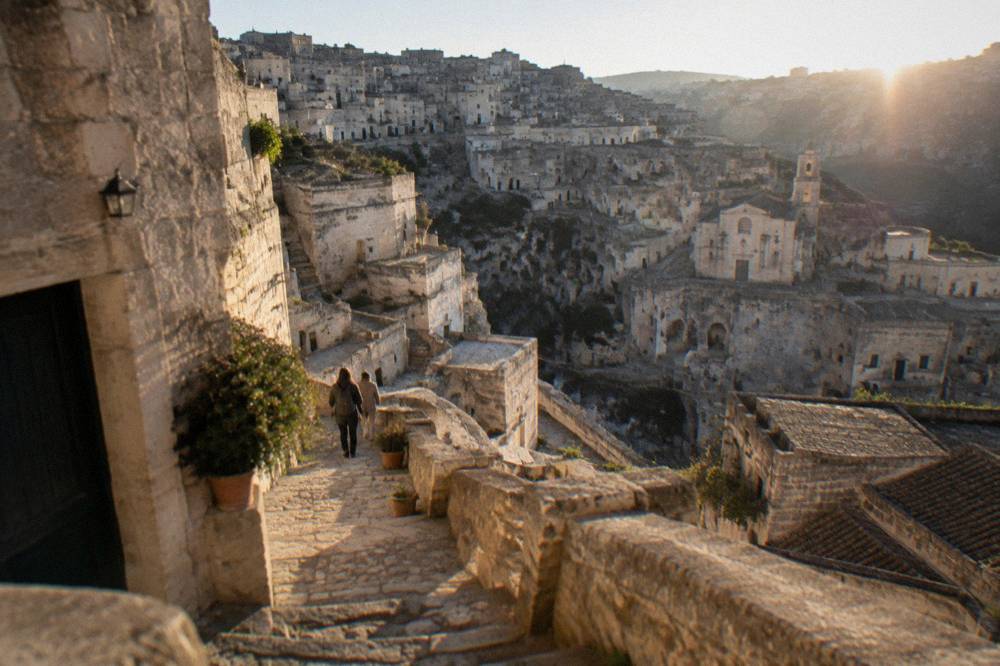 Ticket counter and information sign at a cave site in Matera