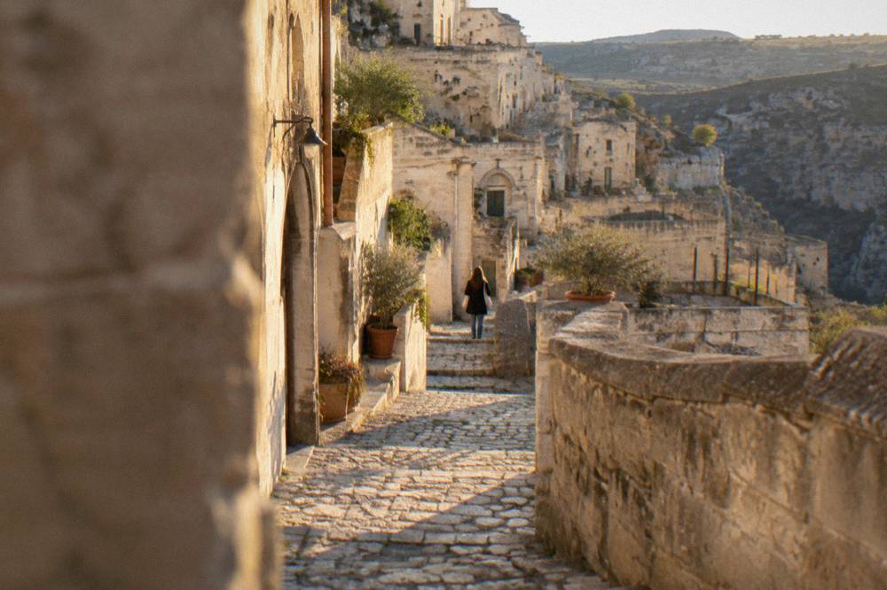 Stepped stone lanes in the Sasso Barisano district of Matera at golden hour