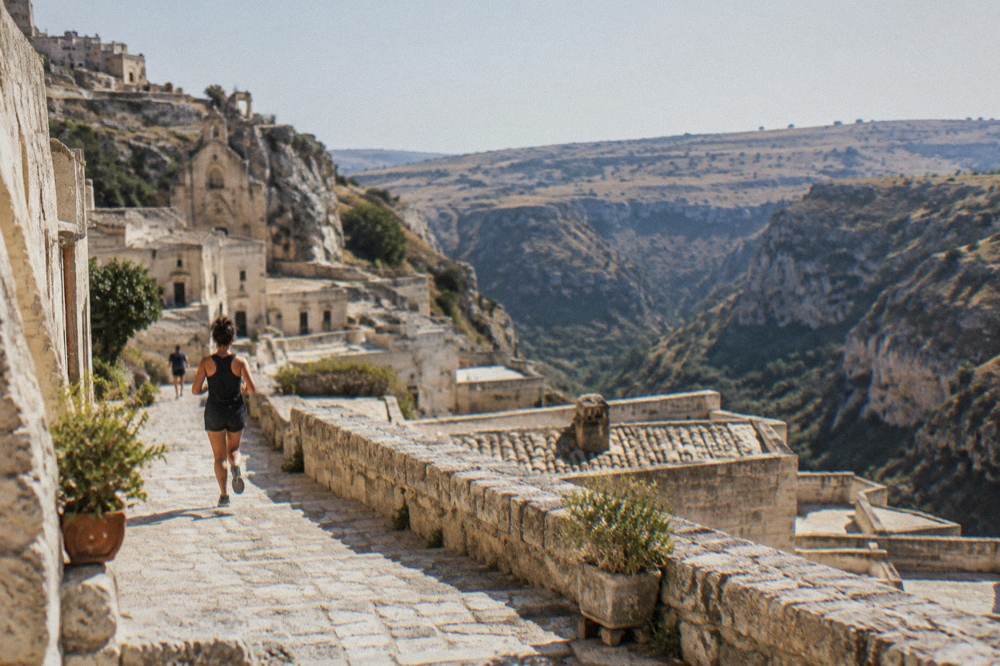 The view from a Sassi terrace toward the rocky Murgia plateau across a deep canyon