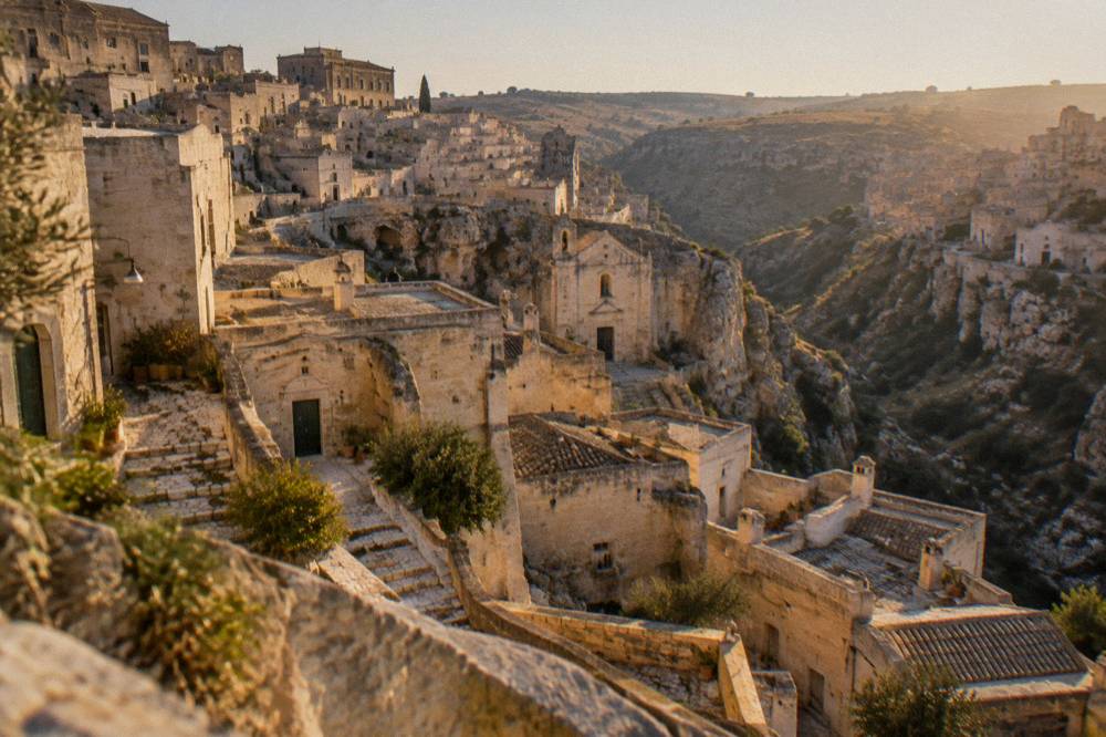 Cave dwellings and stone façades stacked along a canyon rim in Matera