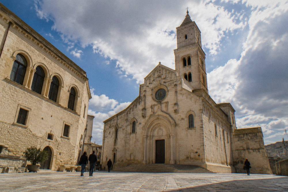 A stone palazzo with arched windows near Matera Cathedral on the Piano quarter