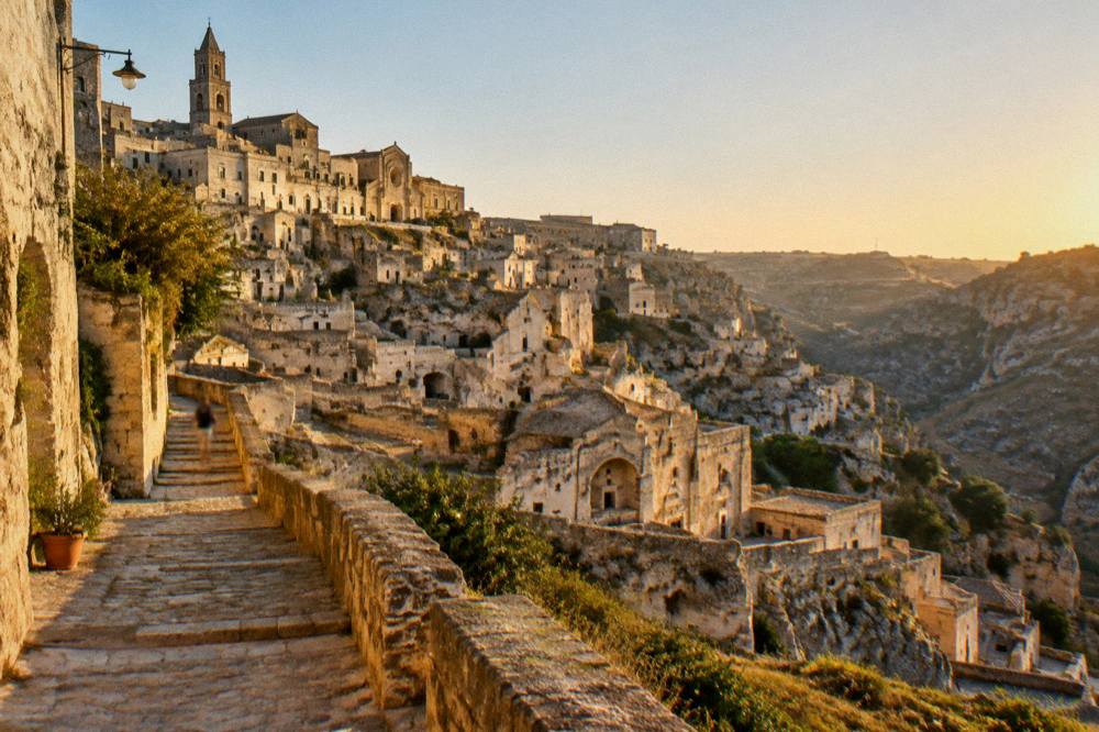 Golden evening light on the cave houses of Matera seen from the canyon rim