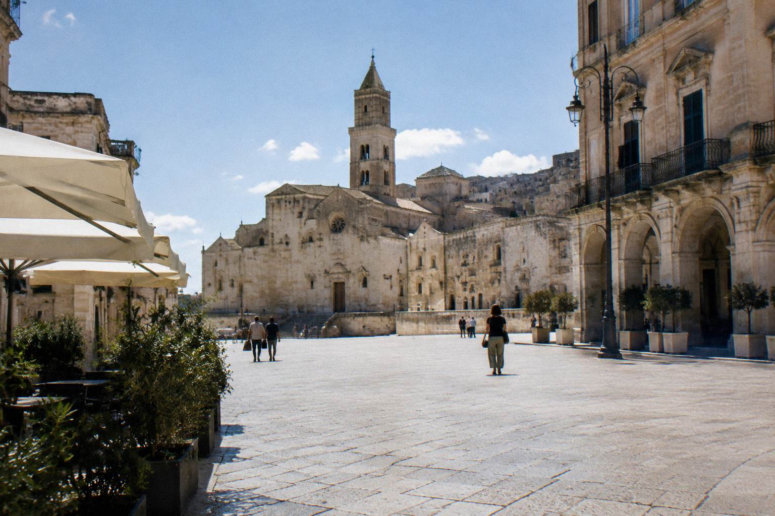 Piazza Vittorio Veneto, a wide paved square with historic facades, seen on a bright day