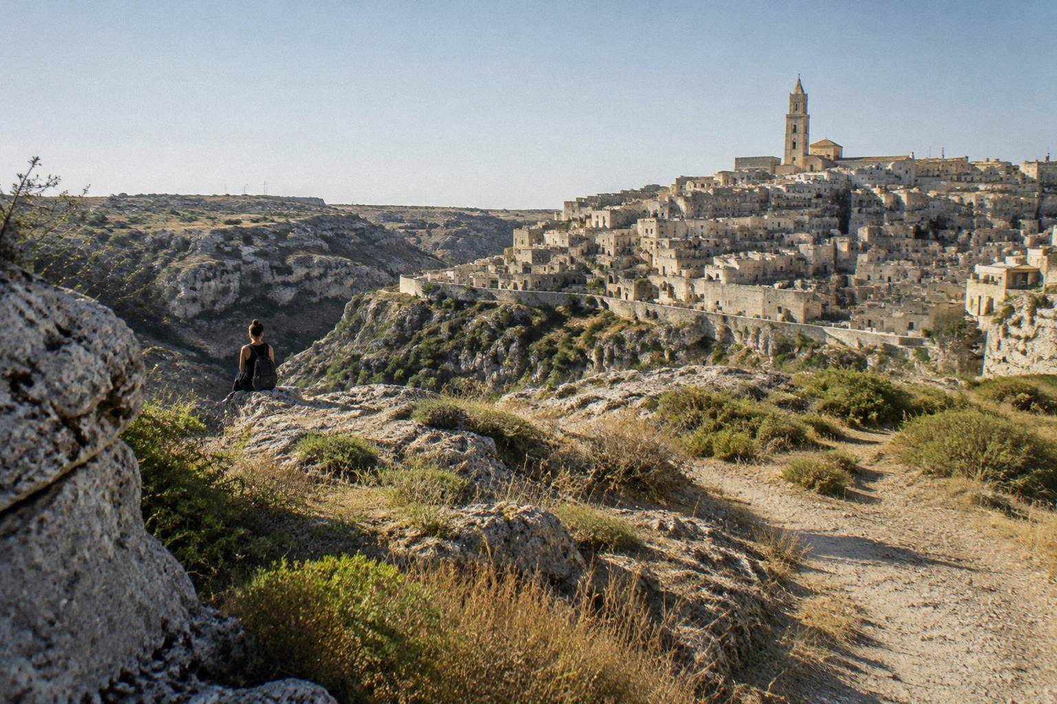 Dry limestone plateau of the Murgia with rock outcrops and low scrub, facing the Sassi