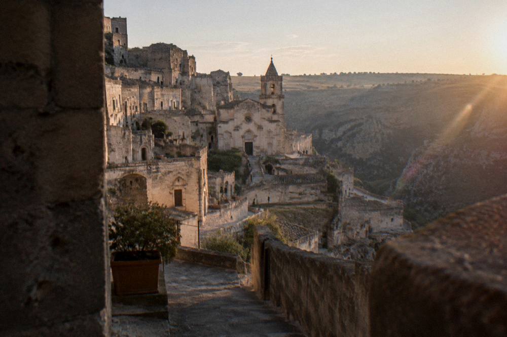 Warm evening light on the cave church district of Matera with the Murgia plateau beyond