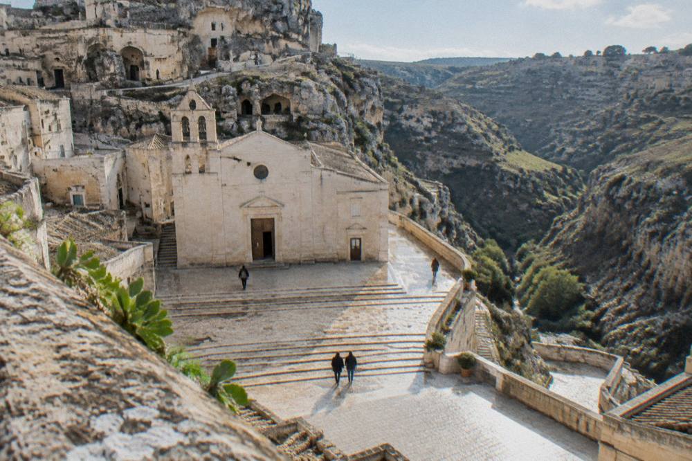 An abandoned hill town with empty stone houses on a ridge in Basilicata