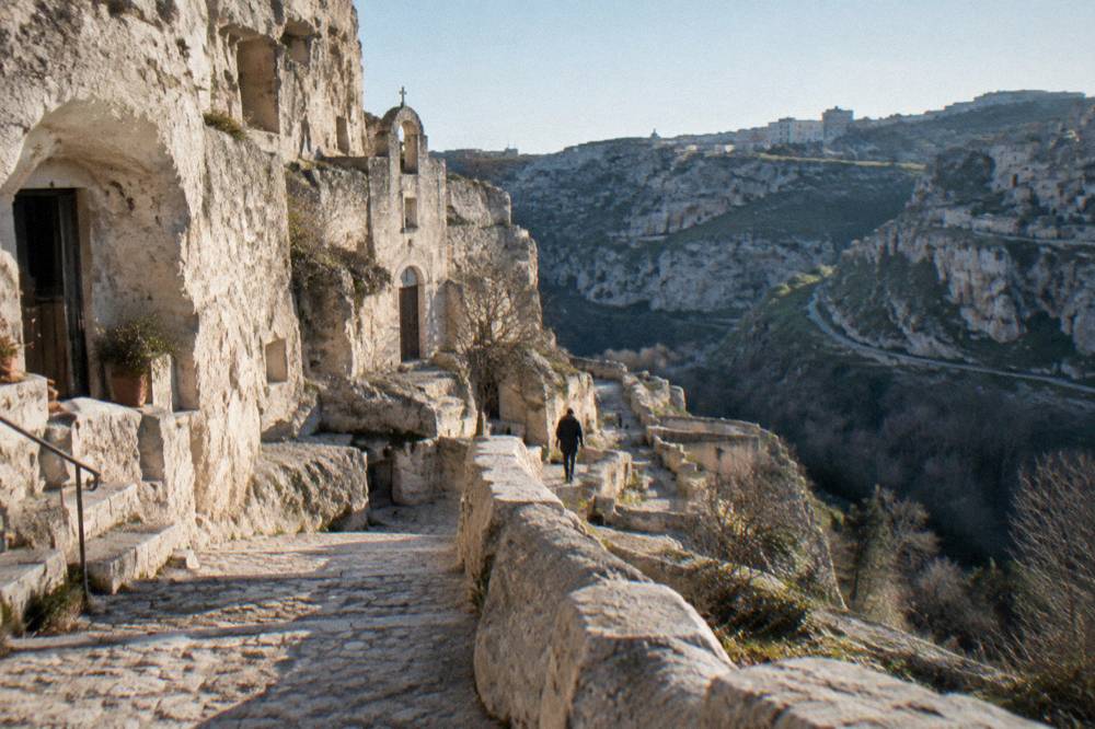 Rock-cut staircase and cave facades in the Malve district of the Sasso Caveoso