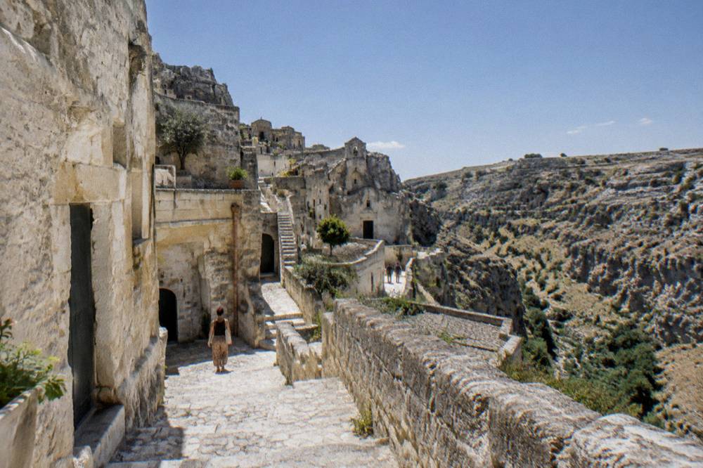 A narrow stepped stone lane between pale cave houses in the Sasso Caveoso quarter of Matera