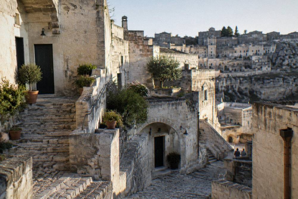 Stone facades and external staircases of restored dwellings in Sasso Barisano