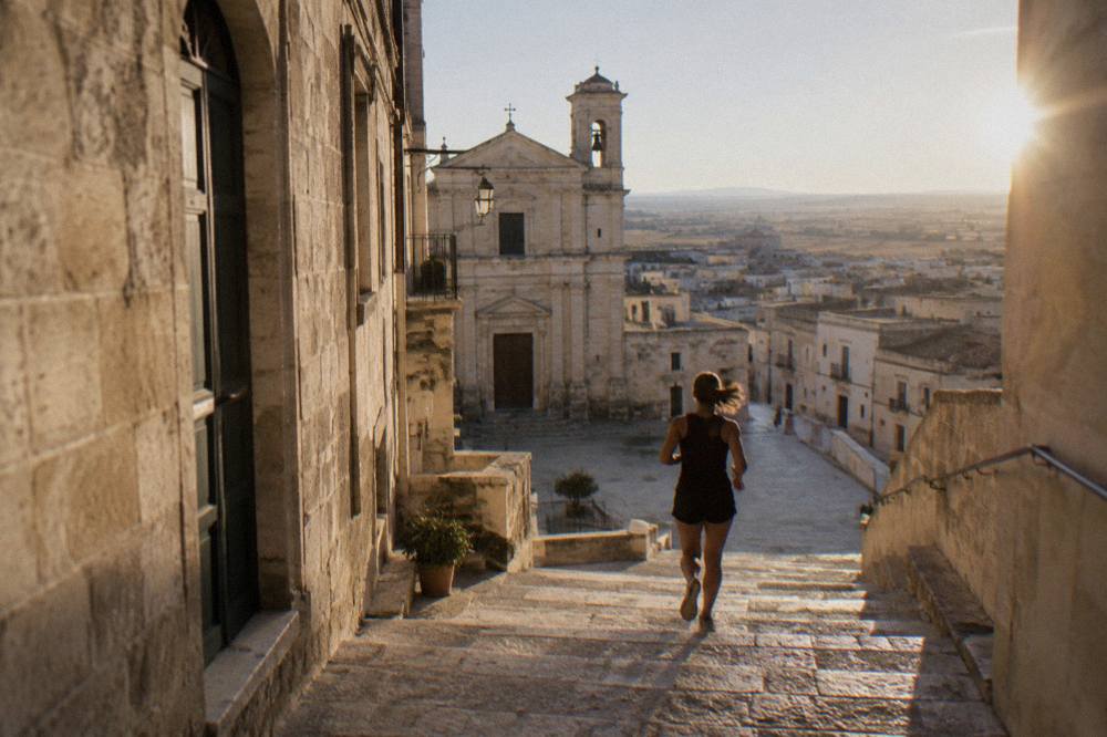 Rooftops of a southern Italian town on a flat plateau under a clear sky