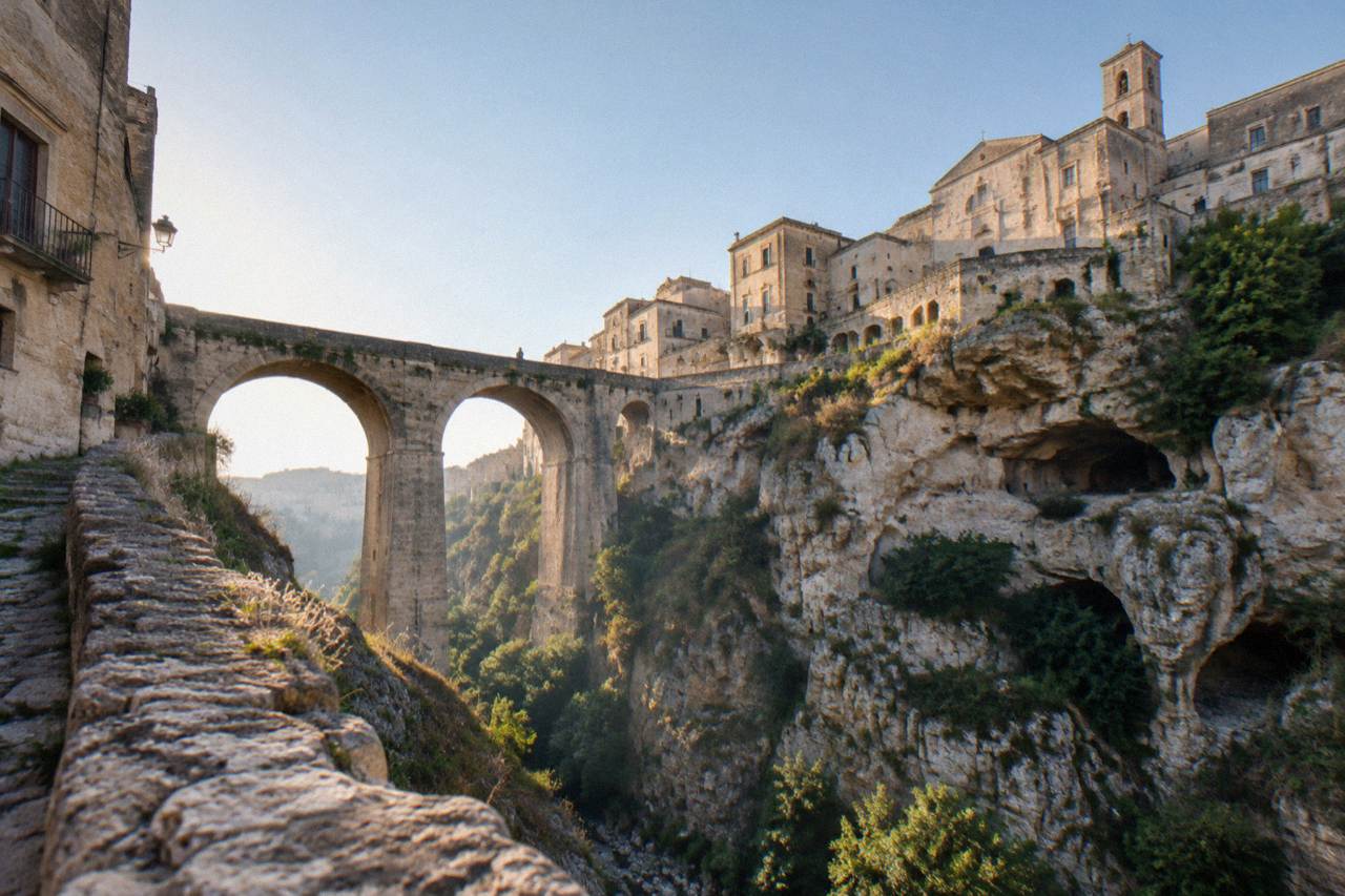 A stone town on the edge of a deep ravine in southern Italy