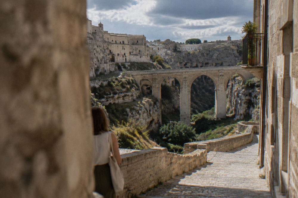 Narrow stone lanes and old dwellings carved into a canyon wall