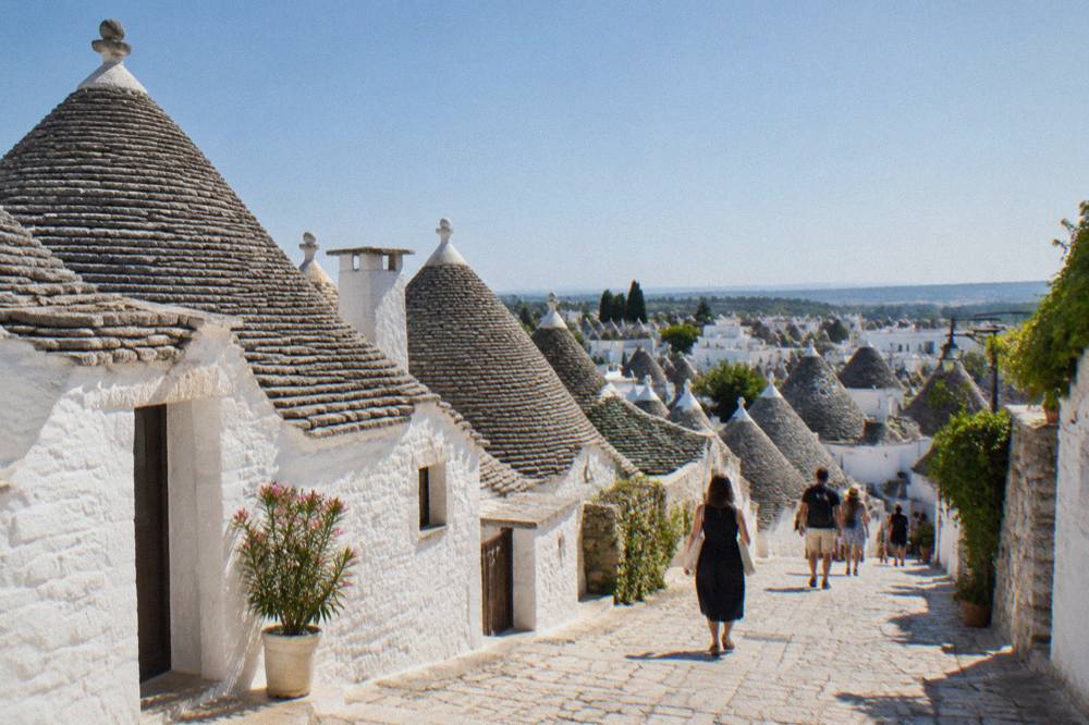 Conical trulli rooftops of a small Puglian town at midday