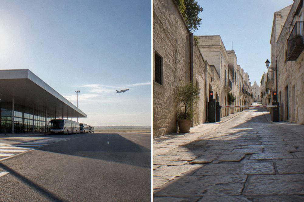 A narrow stone street in an Italian hill town with an electronic traffic gate at its entrance