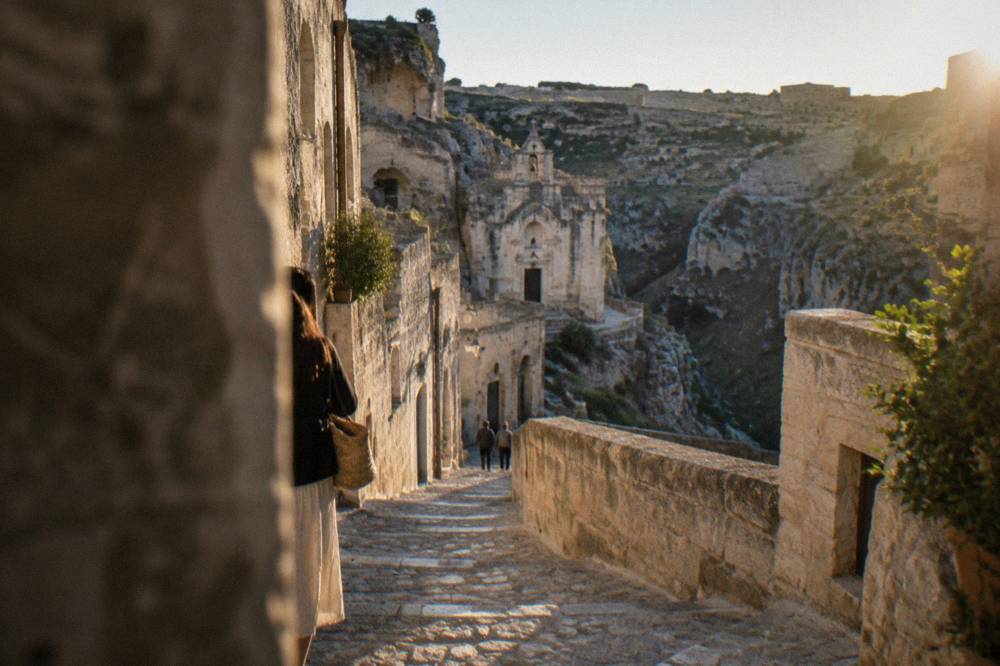 A narrow stepped lane with stone facades in the Sasso Caveoso of Matera