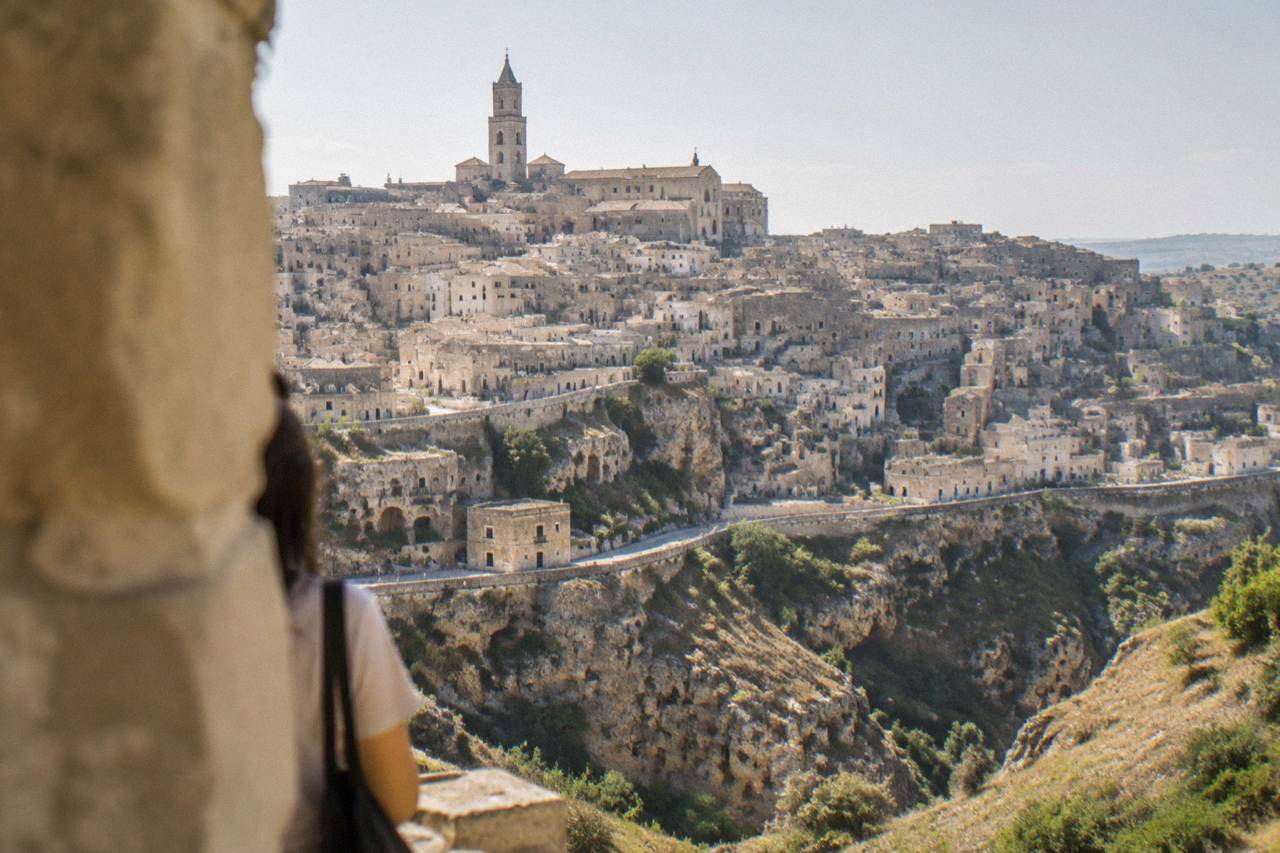 The Sassi district of Matera seen from across the Gravina canyon in soft morning light