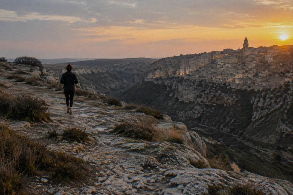 Evening light on the facade of the Sassi above the Gravina canyon at sunset
