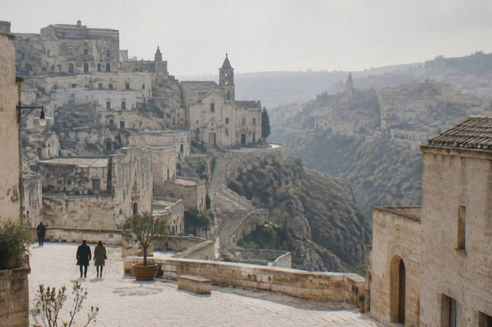 A quiet stone square in Matera on an overcast winter afternoon