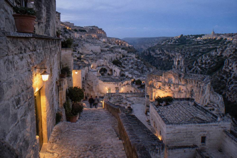 Narrow stepped stone lane between cave dwellings in the Sassi of Matera