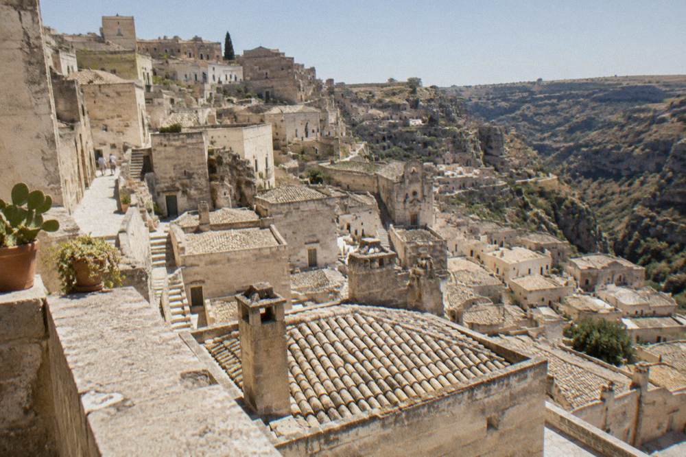 Golden stone rooftops and chimney stacks of the Sassi seen from a high terrace