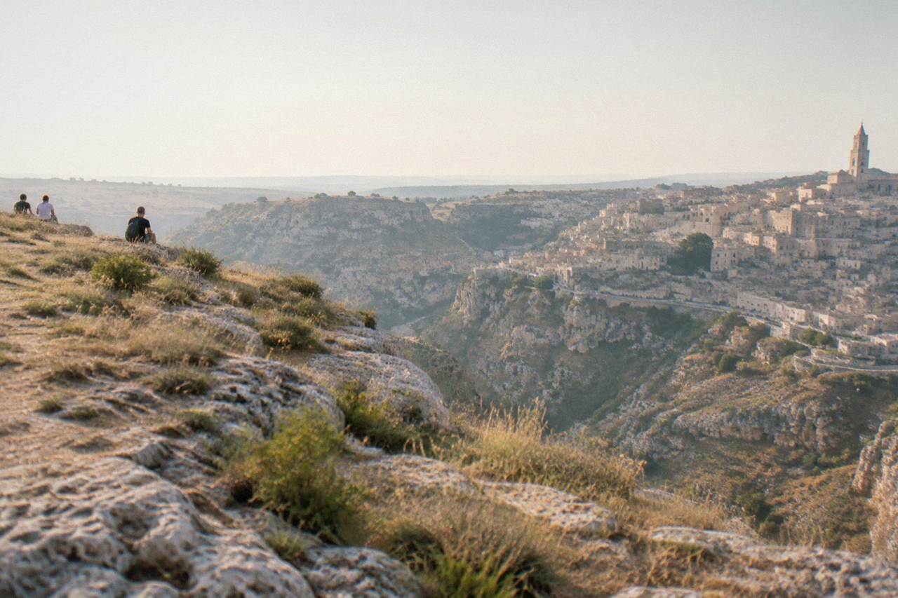 Terrace above cave buildings in the Sassi of Matera overlooking the Gravina canyon at dusk