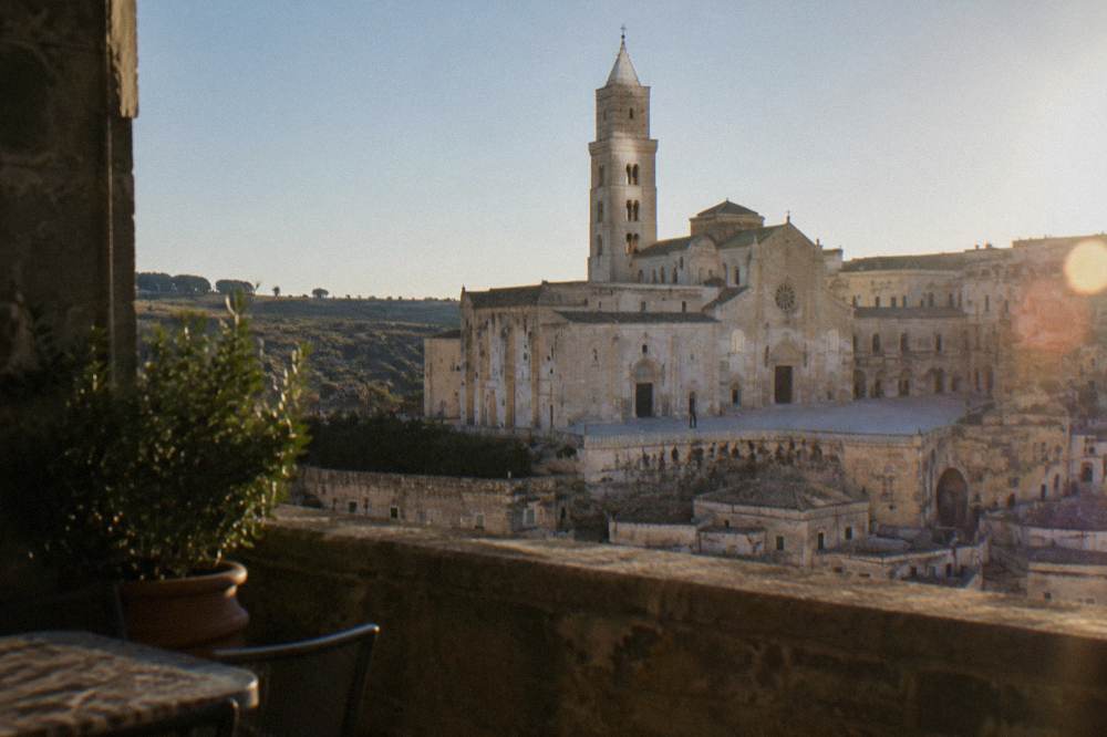 The Romanesque cathedral of Matera seen from a rooftop terrace above the old city