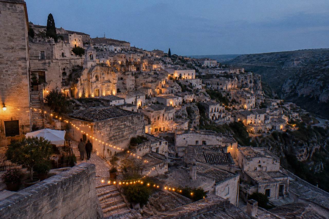 Festive lights over the cave dwellings of the Sassi in Matera at dusk