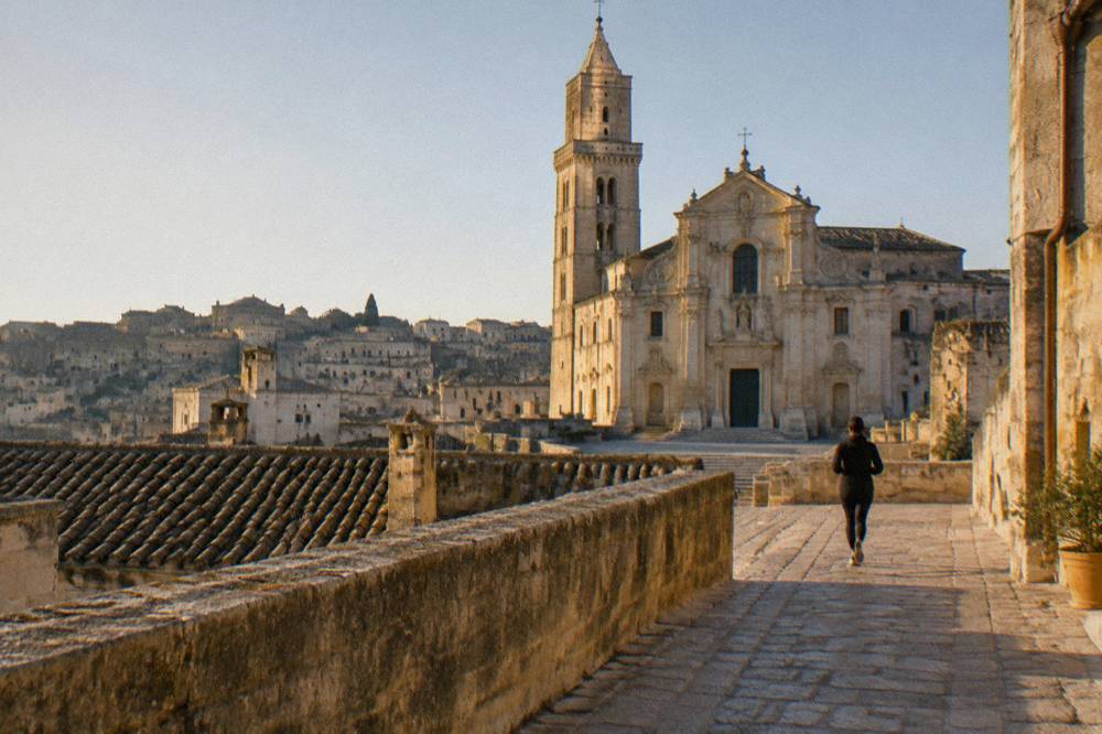 The baroque facade of Matera Cathedral seen from a rooftop in winter light
