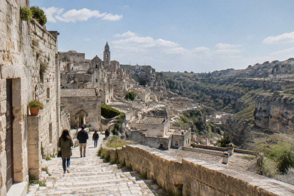 Stepped stone lane between cave houses in the Sassi of Matera in spring light