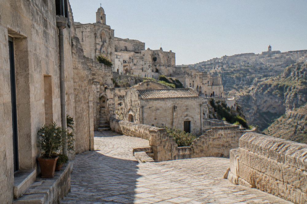 Stone street corner in the Sassi used as a film location, empty in early morning light