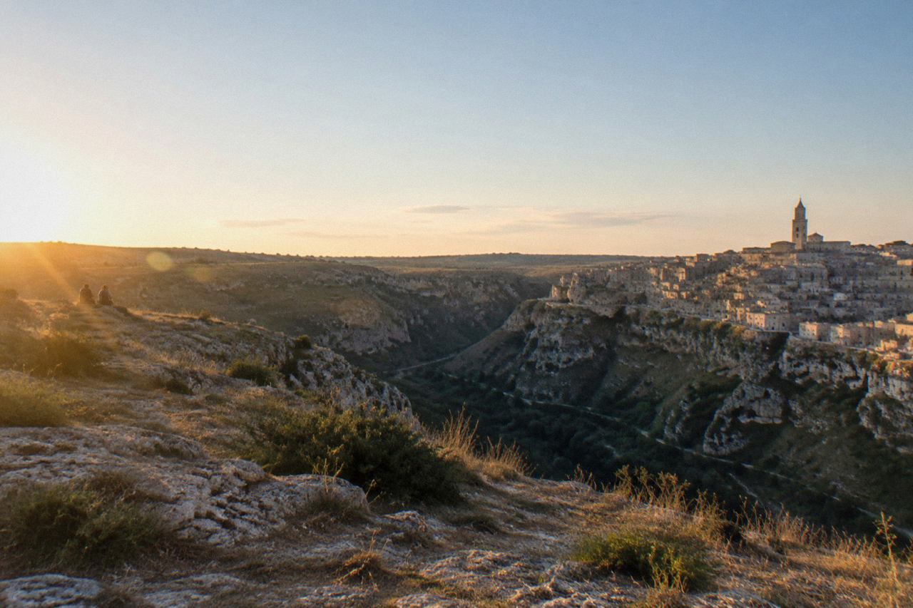 Stone buildings and cave dwellings of the Sassi districts of Matera seen across the Gravina canyon