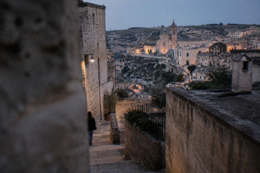 A narrow stepped lane between stone houses in the Sassi districts of Matera