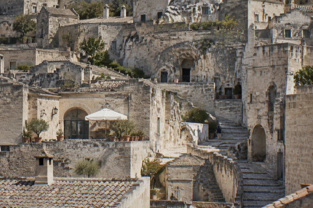 Stepped stone lanes and restored cave house facades in the Sasso Barisano quarter