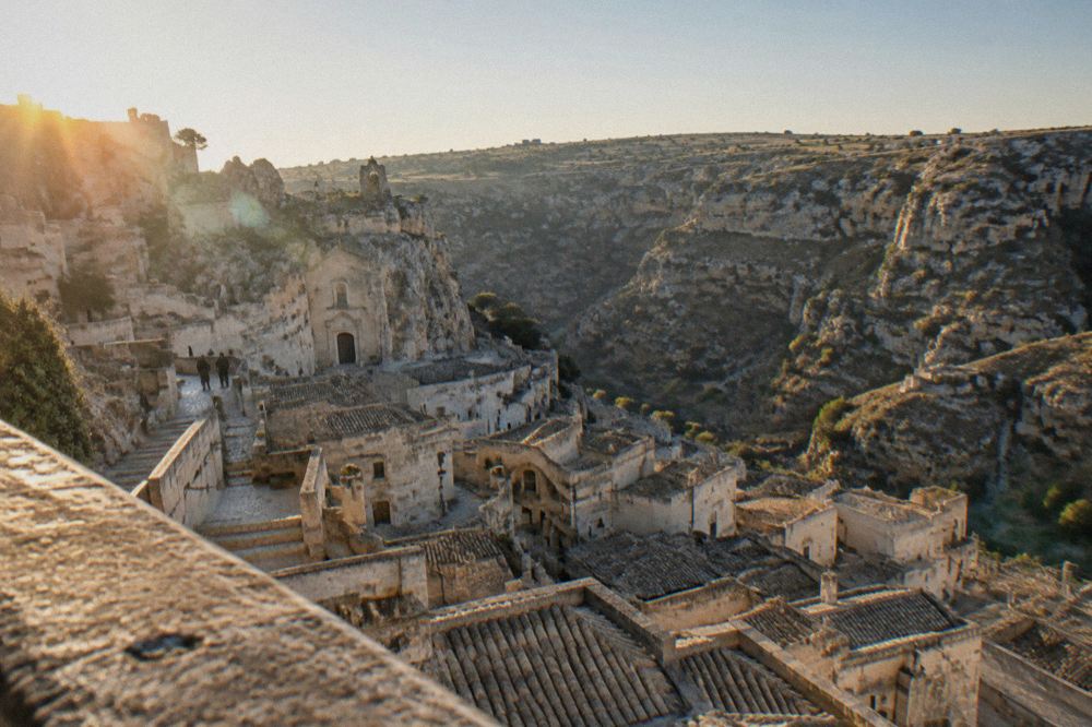 A panoramic view over the Sasso Caveoso rooftops and the canyon beyond from a Matera viewpoint