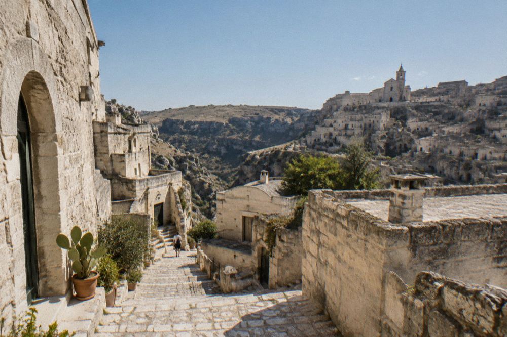 A narrow stepped stone lane between cave dwellings in the Sassi district of Matera