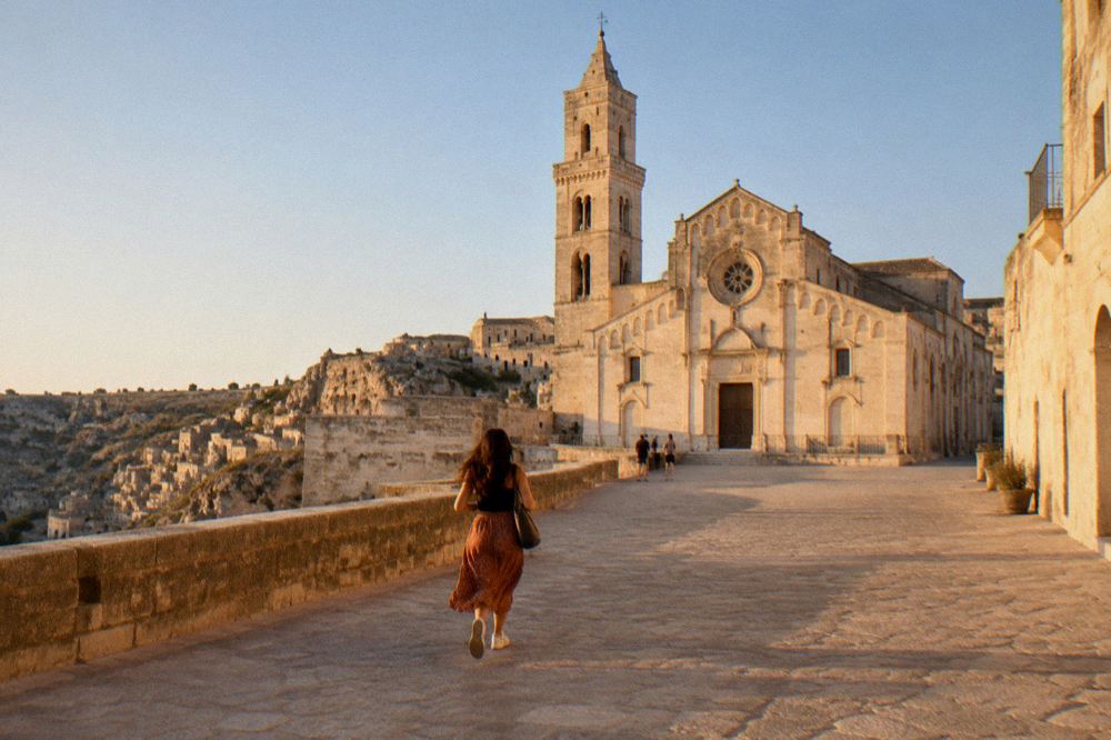 The Romanesque cathedral of Matera on its ridge above the Sassi under a clear sky