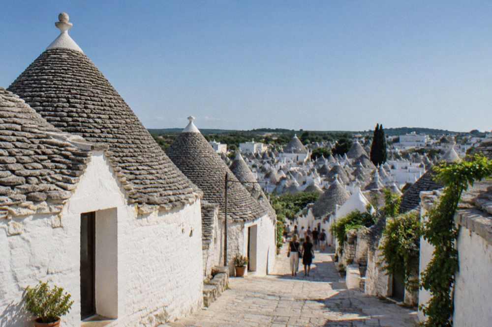 Trulli houses with conical stone roofs seen across the rooftops of Alberobello