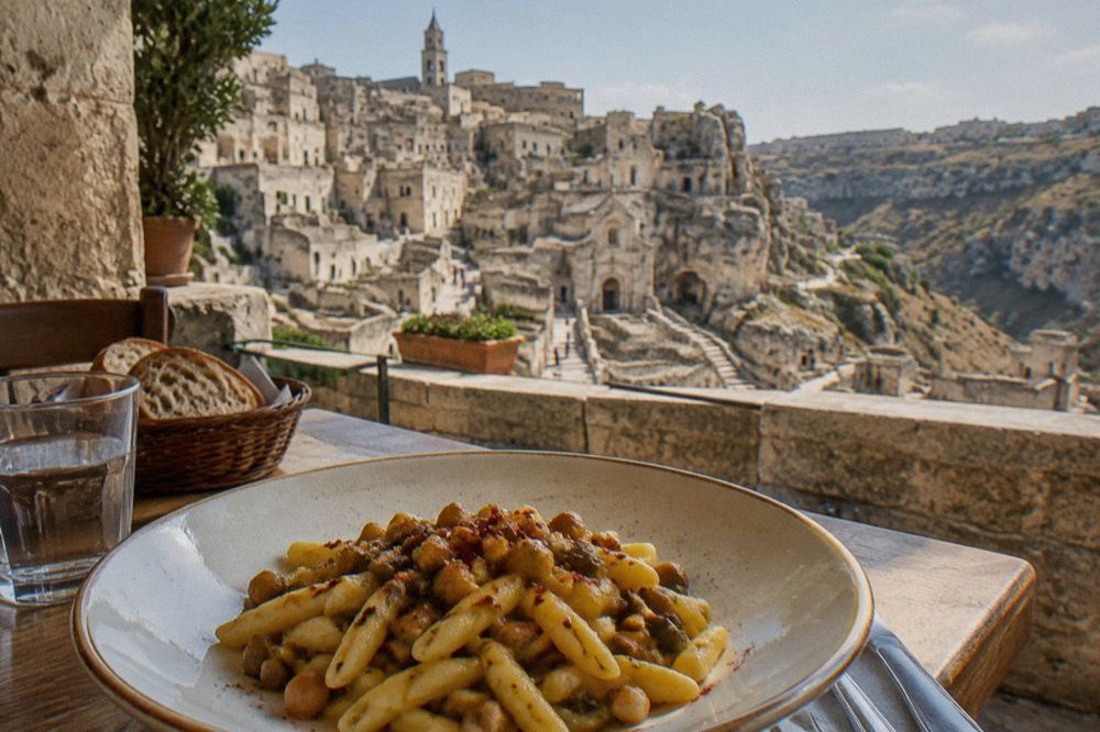 A plate of pasta with chickling peas topped with crisp red pepper flakes in a Matera restaurant