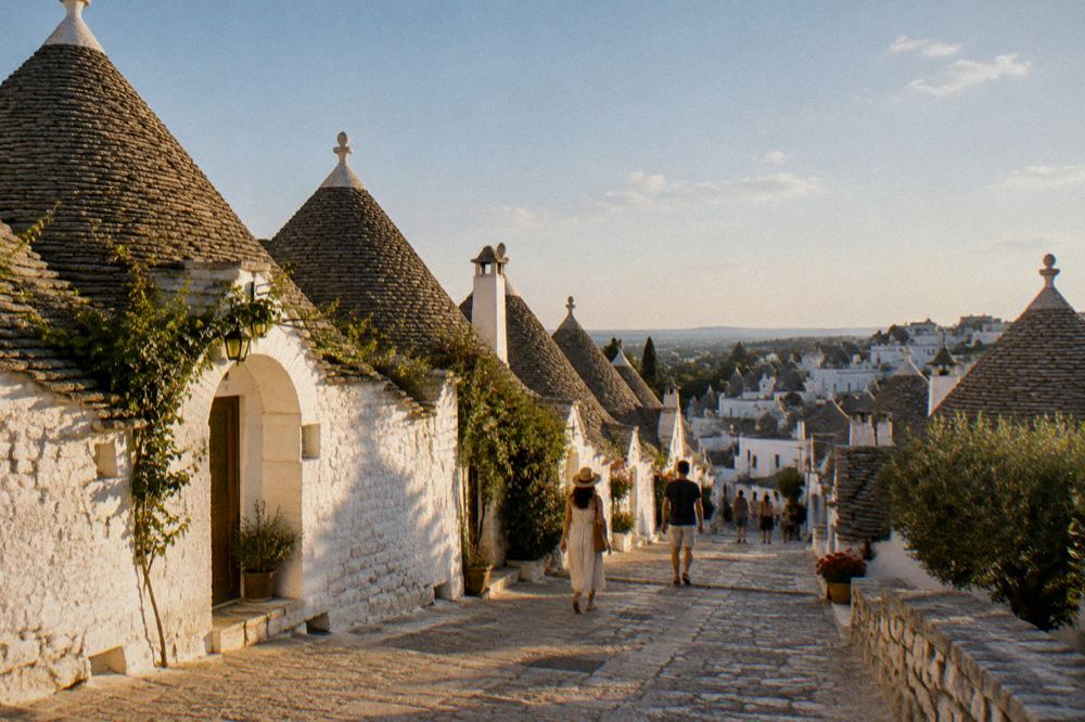 Whitewashed trulli houses with conical stone roofs in Alberobello