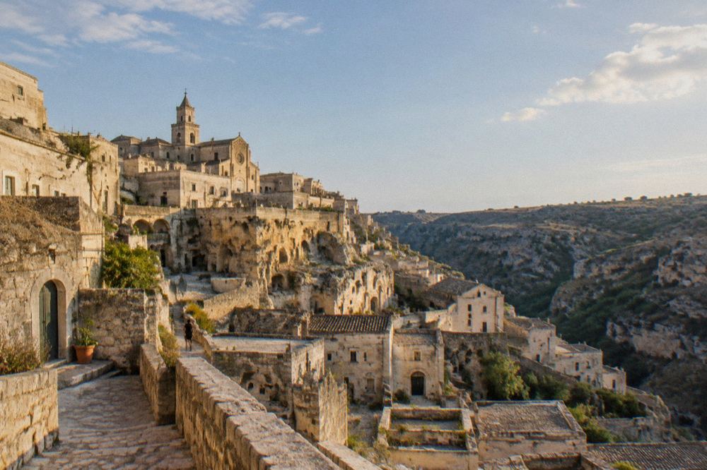 Stone stairways and cave facades in warm evening light in the Sassi districts