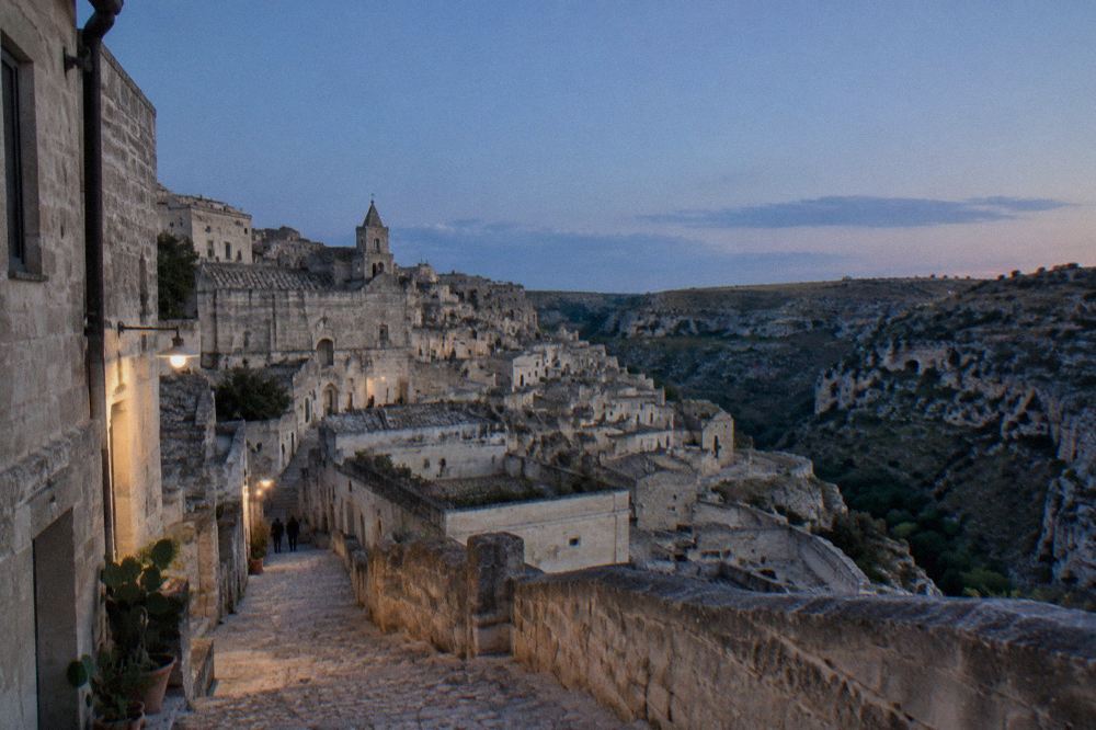 A steep stepped lane between stone houses in the Sasso Caveoso quarter of Matera