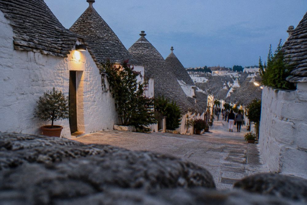 Whitewashed trulli houses with conical stone roofs in Alberobello