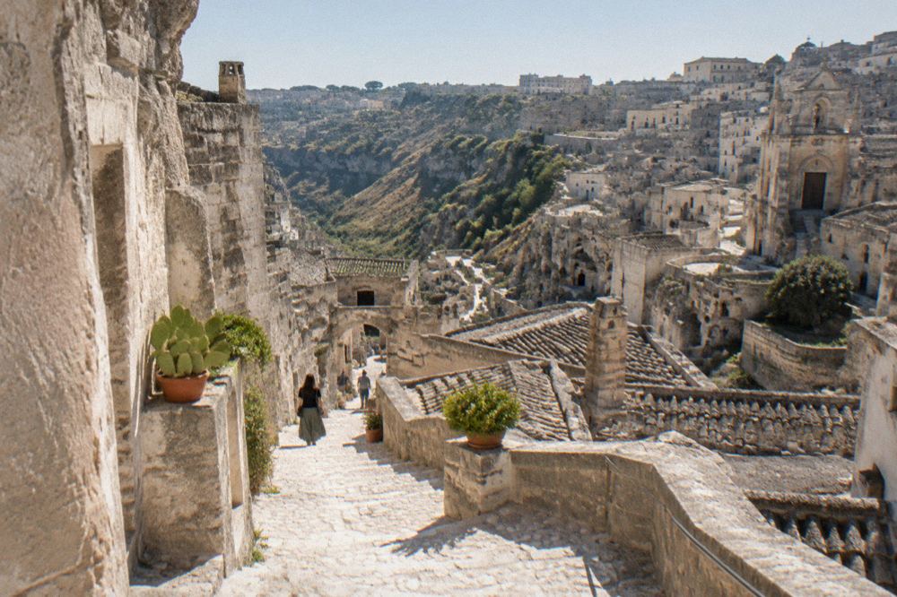 White stone street in the Sassi with staircases descending between old cave dwellings